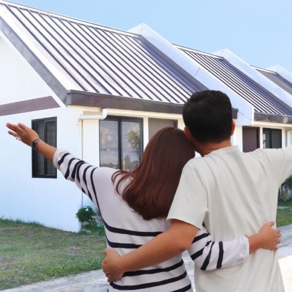 P.A. Properties poster as they celebrate 30 years, with photo showing a couple in front of their dream house