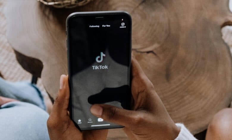 TikTok app on a handheld mobile phone