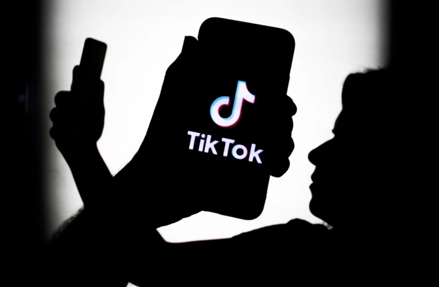 Caricature showing the word 'TikTok' and a man holding a mobile phone