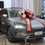 Image of a car with ribbon at the Xpress-BYD partnership launch