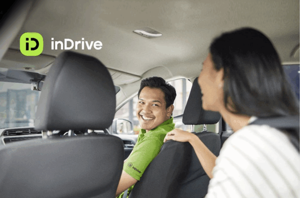 inDrive driver talks to a passenger as he aims to offer a safer, smarter ride