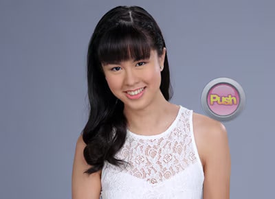 Kisses Delavin wearing a white top
