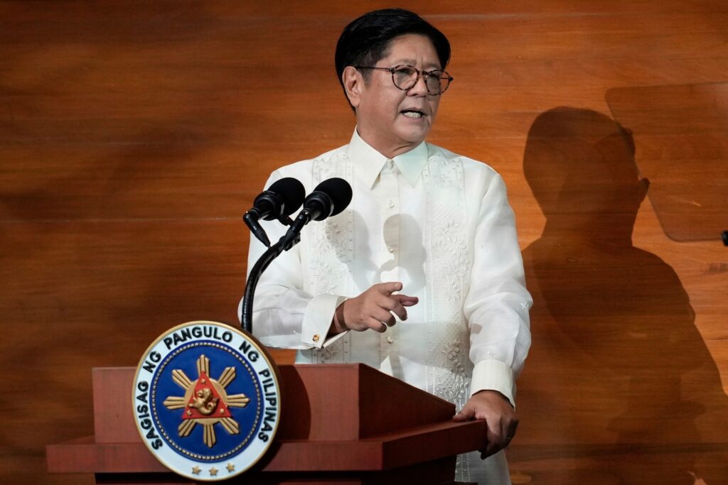 Pres. Ferdinand Marcos Jr. at the podium, pointing at the audience