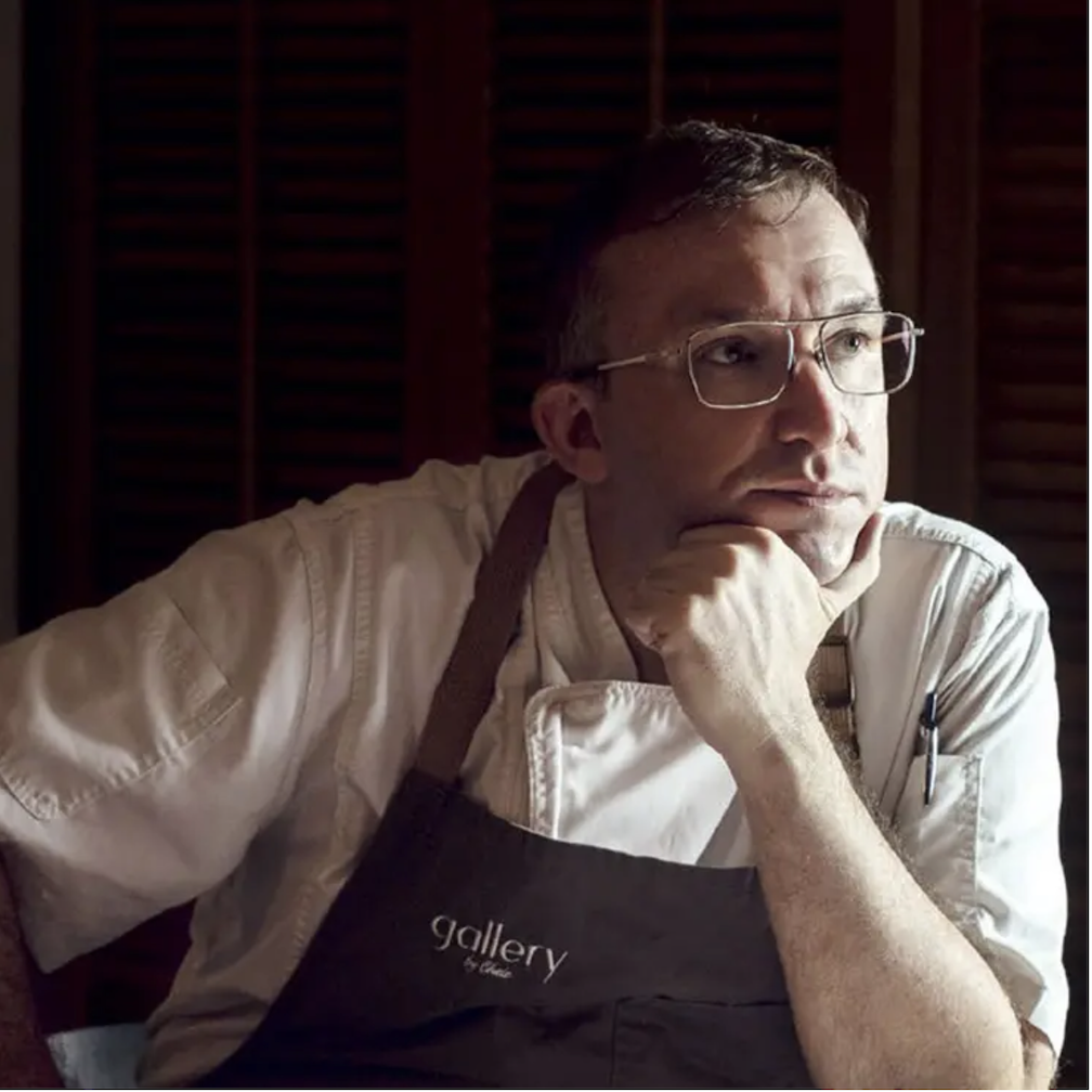 Chele Gonzales, with one of his hands on his chin, is elevating Filipino cuisine globally