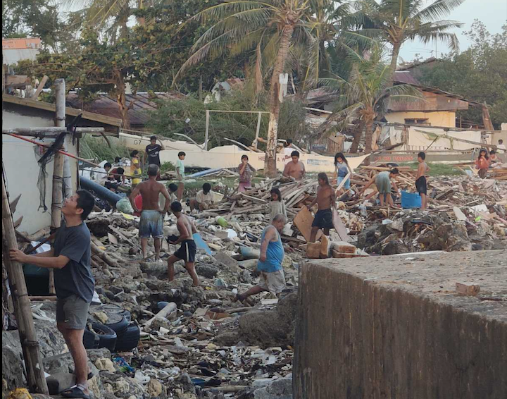 People in Cebu fixing their homes after the Typhoon Tino devastation